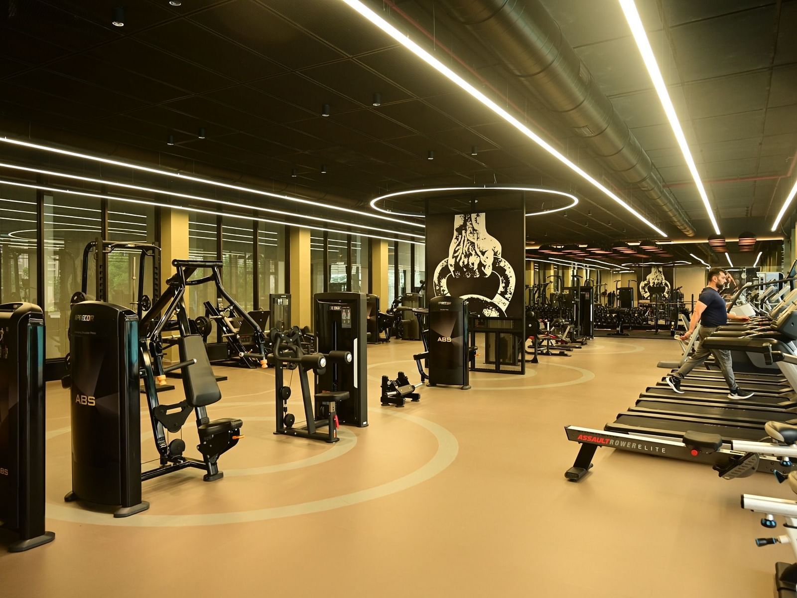 image of a well equipped gymnasium at club charholi, pune